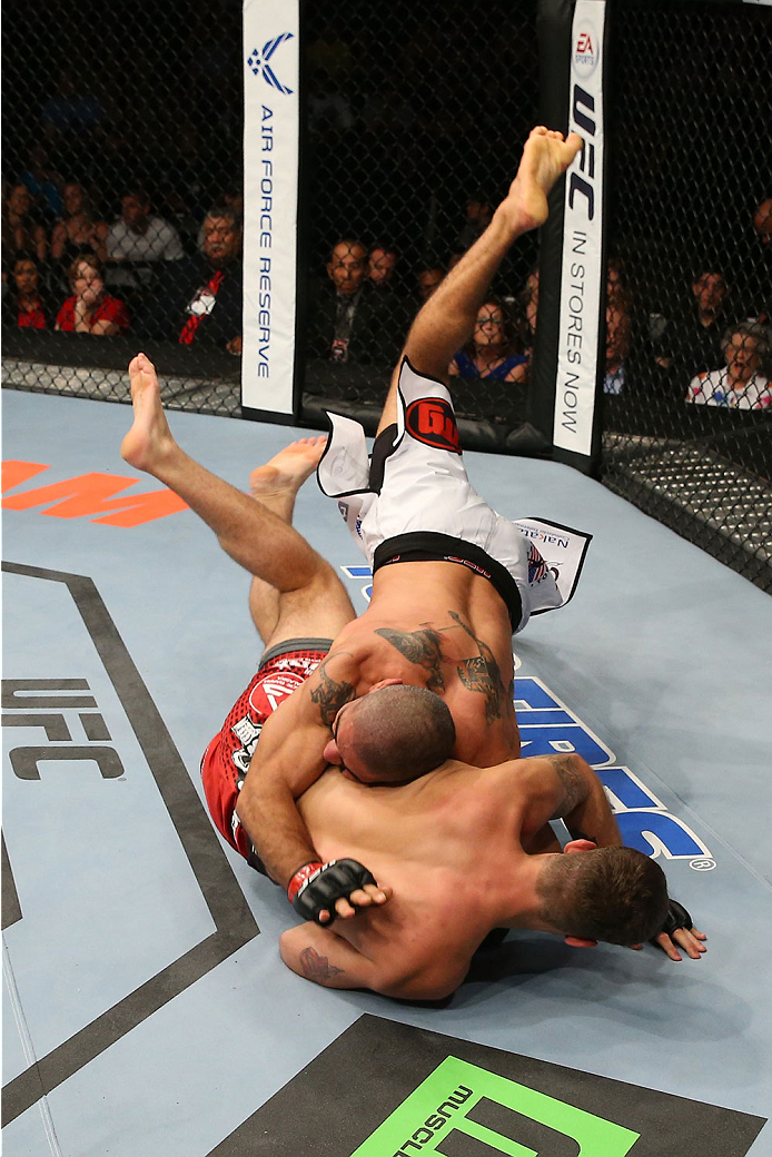 SAN ANTONIO, TX - JUNE 28: Marcelo Guimaraes (top) slams Andy Enz in their middleweight bout at the AT&T Center on June 28, 2014 in San Antonio, Texas. (Photo by Ed Mulholland/Zuffa LLC/Zuffa LLC via Getty Images)