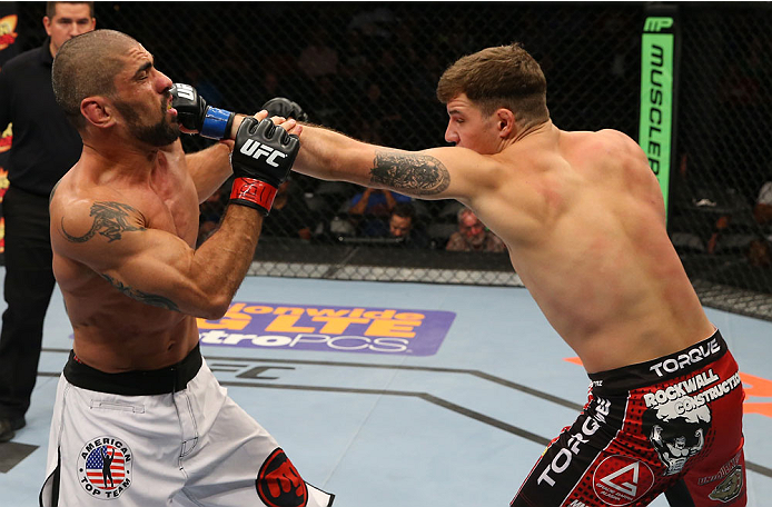 SAN ANTONIO, TX - JUNE 28: (R-L) Andy Enz punches Marcelo Guimaraes in their middleweight bout at the AT&T Center on June 28, 2014 in San Antonio, Texas. (Photo by Ed Mulholland/Zuffa LLC/Zuffa LLC via Getty Images)