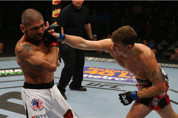 SAN ANTONIO, TX - JUNE 28: (R-L) Andy Enz punches Marcelo Guimaraes in their middleweight bout at the AT&T Center on June 28, 2014 in San Antonio, Texas. (Photo by Ed Mulholland/Zuffa LLC/Zuffa LLC via Getty Images)
