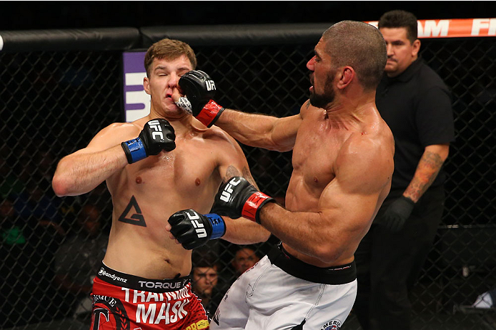 SAN ANTONIO, TX - JUNE 28: (R-L) Marcelo Guimaraes punches Andy Enz in their middleweight bout at the AT&T Center on June 28, 2014 in San Antonio, Texas. (Photo by Ed Mulholland/Zuffa LLC/Zuffa LLC via Getty Images)