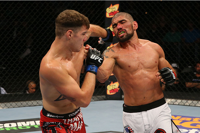 SAN ANTONIO, TX - JUNE 28: (L-R) Andy Enz and Marcelo Guimaraes exchange punches in their middleweight bout at the AT&T Center on June 28, 2014 in San Antonio, Texas. (Photo by Ed Mulholland/Zuffa LLC/Zuffa LLC via Getty Images)