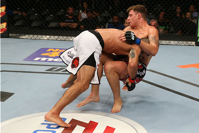 SAN ANTONIO, TX - JUNE 28: Marcelo Guimaraes (left) takes down Andy Enz in their middleweight bout at the AT&T Center on June 28, 2014 in San Antonio, Texas. (Photo by Ed Mulholland/Zuffa LLC/Zuffa LLC via Getty Images)