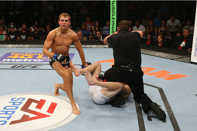 SAN ANTONIO, TX - JUNE 28: Cody Gibson (left) reacts as the referee stops his fight with Johnny Bedford at the AT&T Center on June 28, 2014 in San Antonio, Texas. (Photo by Ed Mulholland/Zuffa LLC/Zuffa LLC via Getty Images)