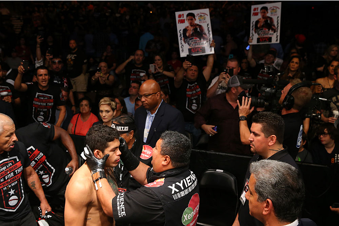 SAN ANTONIO, TX - JUNE 28: Carlos Diego Ferreira (bottom) gets prepared to enter the Octagon to face Colton Smith in their lightweight bout at the AT&T Center on June 28, 2014 in San Antonio, Texas. (Photo by Ed Mulholland/Zuffa LLC/Zuffa LLC via Getty I