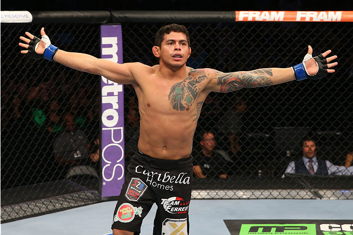 SAN ANTONIO, TX - JUNE 28: Carlos Diego Ferreira reacts to his victory over Colton Smith in their lightweight bout at the AT&T Center on June 28, 2014 in San Antonio, Texas. (Photo by Ed Mulholland/Zuffa LLC/Zuffa LLC via Getty Images)