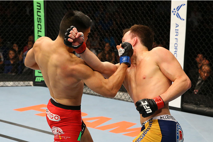 SAN ANTONIO, TX - JUNE 28: (L-R) James Moontasri punches Joe Ellenberger in their lightweight bout at the AT&T Center on June 28, 2014 in San Antonio, Texas. (Photo by Ed Mulholland/Zuffa LLC/Zuffa LLC via Getty Images)