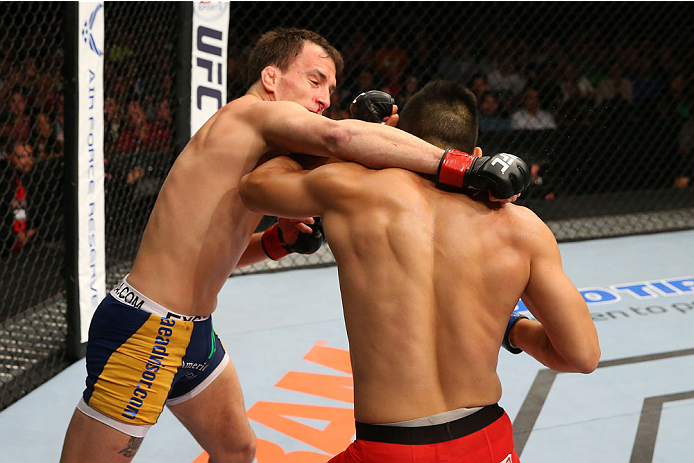 SAN ANTONIO, TX - JUNE 28: (L-R) Joe Ellenberger punches James Moontasri in their lightweight bout at the AT&T Center on June 28, 2014 in San Antonio, Texas. (Photo by Ed Mulholland/Zuffa LLC/Zuffa LLC via Getty Images)