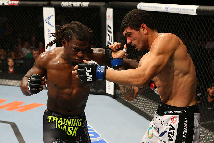 SAN ANTONIO, TX - JUNE 28: (L-R) Clint Hester punches Antonio Braga Neto in their middleweight bout at the AT&T Center on June 28, 2014 in San Antonio, Texas. (Photo by Ed Mulholland/Zuffa LLC/Zuffa LLC via Getty Images)