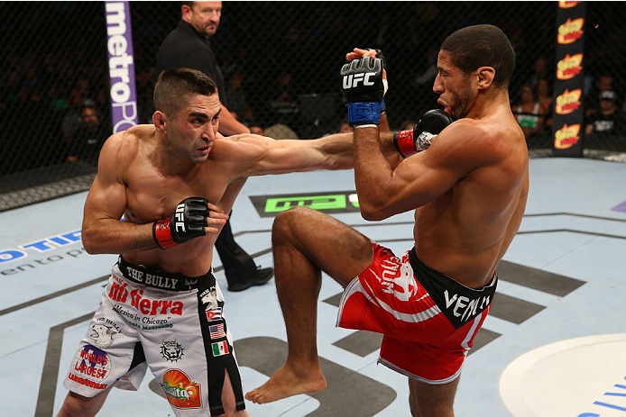 SAN ANTONIO, TX - JUNE 28: (L-R) Ricardo Lamas punches Hacran Dias in their featherweight bout at the AT&T Center on June 28, 2014 in San Antonio, Texas. (Photo by Ed Mulholland/Zuffa LLC/Zuffa LLC via Getty Images)