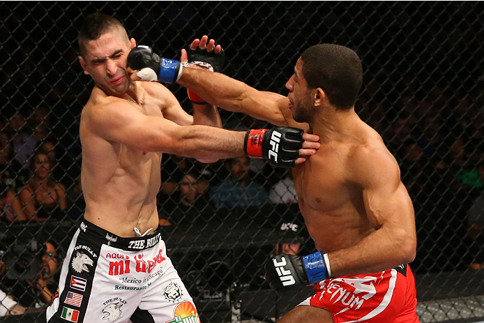 SAN ANTONIO, TX - JUNE 28: (R-L) Hacran Dias punches Ricardo Lamas in their featherweight bout at the AT&T Center on June 28, 2014 in San Antonio, Texas. (Photo by Ed Mulholland/Zuffa LLC/Zuffa LLC via Getty Images)
