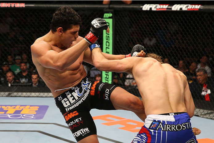 SAN ANTONIO, TX - JUNE 28: (L-R) Cezar Ferreira kicks Andrew Craig in their middleweight bout at the AT&T Center on June 28, 2014 in San Antonio, Texas. (Photo by Ed Mulholland/Zuffa LLC/Zuffa LLC via Getty Images)