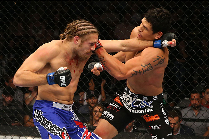 SAN ANTONIO, TX - JUNE 28: (L-R) Andrew Craig and Cezar Ferreira exchange punches in their middleweight bout at the AT&T Center on June 28, 2014 in San Antonio, Texas. (Photo by Ed Mulholland/Zuffa LLC/Zuffa LLC via Getty Images)