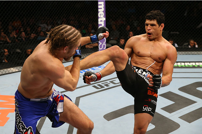 SAN ANTONIO, TX - JUNE 28: (R-L) Cezar Ferreira kicks Andrew Craig in their middleweight bout at the AT&T Center on June 28, 2014 in San Antonio, Texas. (Photo by Ed Mulholland/Zuffa LLC/Zuffa LLC via Getty Images)