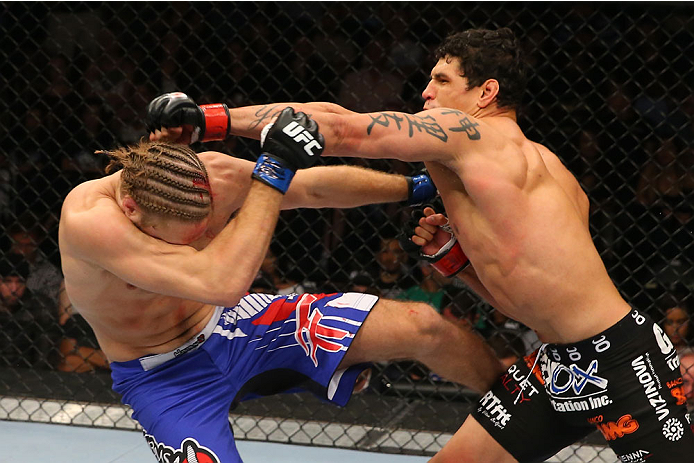 SAN ANTONIO, TX - JUNE 28: (R-L) Cezar Ferreira punches Andrew Craig in their middleweight bout at the AT&T Center on June 28, 2014 in San Antonio, Texas. (Photo by Ed Mulholland/Zuffa LLC/Zuffa LLC via Getty Images)