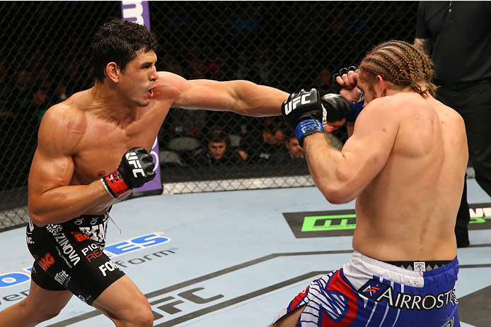 SAN ANTONIO, TX - JUNE 28: (L-R) Cezar Ferreira punches Andrew Craig in their middleweight bout at the AT&T Center on June 28, 2014 in San Antonio, Texas. (Photo by Ed Mulholland/Zuffa LLC/Zuffa LLC via Getty Images)