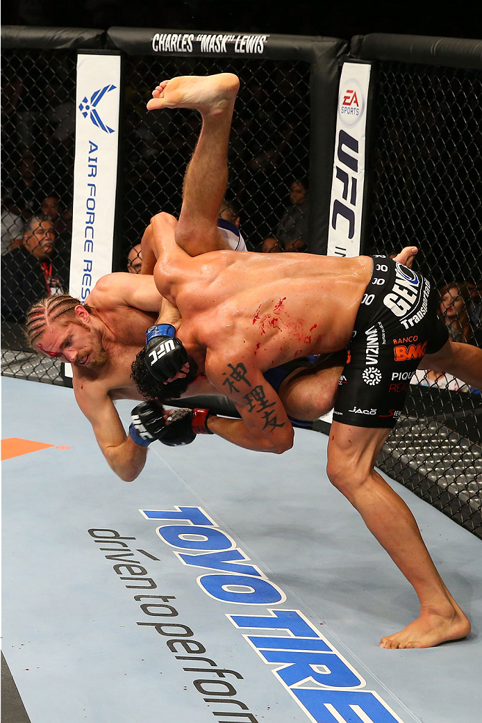 SAN ANTONIO, TX - JUNE 28: Cezar Ferreira (black shorts) slams Andrew Craig in their middleweight bout at the AT&T Center on June 28, 2014 in San Antonio, Texas. (Photo by Ed Mulholland/Zuffa LLC/Zuffa LLC via Getty Images)