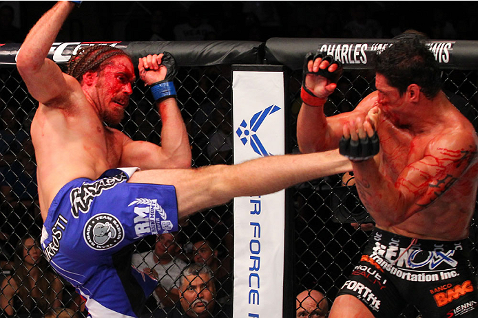 SAN ANTONIO, TX - JUNE 28: (L-R) Andrew Craig kicks Cezar Ferreira in their middleweight bout at the AT&T Center on June 28, 2014 in San Antonio, Texas. (Photo by Ed Mulholland/Zuffa LLC/Zuffa LLC via Getty Images)