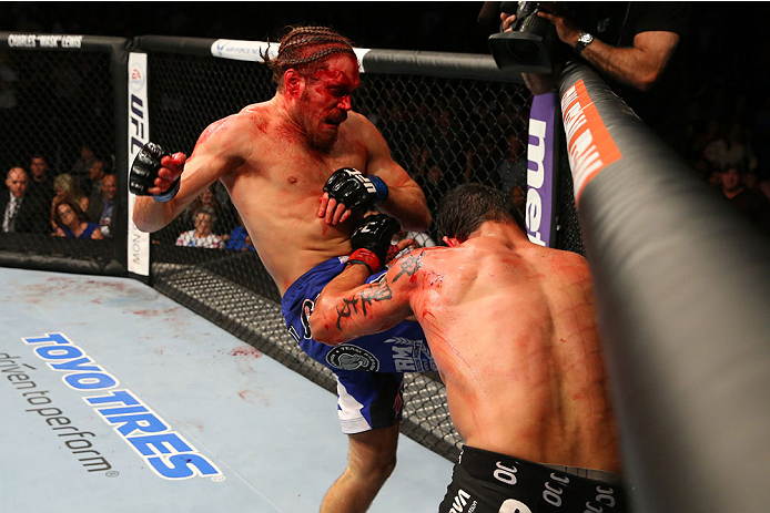 SAN ANTONIO, TX - JUNE 28: Andrew Craig (left) knees Cezar Ferreira in their middleweight bout at the AT&T Center on June 28, 2014 in San Antonio, Texas. (Photo by Ed Mulholland/Zuffa LLC/Zuffa LLC via Getty Images)