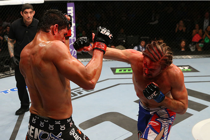SAN ANTONIO, TX - JUNE 28: (R-L) Andrew Craig punches Cezar Ferreira in their middleweight bout at the AT&T Center on June 28, 2014 in San Antonio, Texas. (Photo by Ed Mulholland/Zuffa LLC/Zuffa LLC via Getty Images)