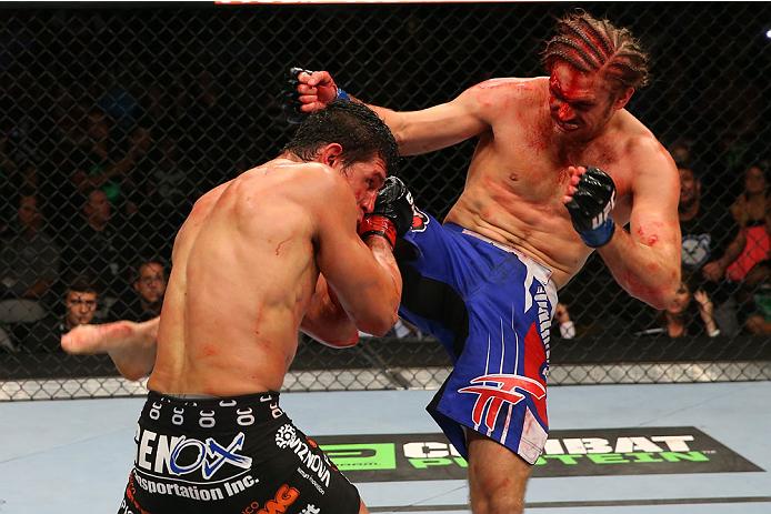 SAN ANTONIO, TX - JUNE 28: (R-L) Andrew Craig kicks Cezar Ferreira in their middleweight bout at the AT&T Center on June 28, 2014 in San Antonio, Texas. (Photo by Ed Mulholland/Zuffa LLC/Zuffa LLC via Getty Images)