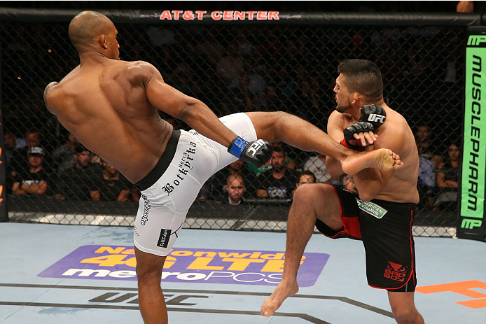SAN ANTONIO, TX - JUNE 28: (L-R) Nico Musoke kicks Kelvin Gastelum in their welterweight bout at the AT&T Center on June 28, 2014 in San Antonio, Texas. (Photo by Ed Mulholland/Zuffa LLC/Zuffa LLC via Getty Images)