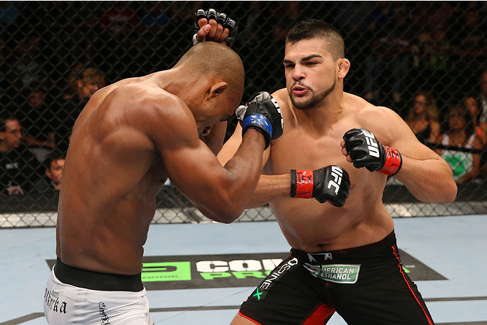 SAN ANTONIO, TX - JUNE 28: (R-L) Kelvin Gastelum punches Nico Musoke in their welterweight bout at the AT&T Center on June 28, 2014 in San Antonio, Texas. (Photo by Ed Mulholland/Zuffa LLC/Zuffa LLC via Getty Images)