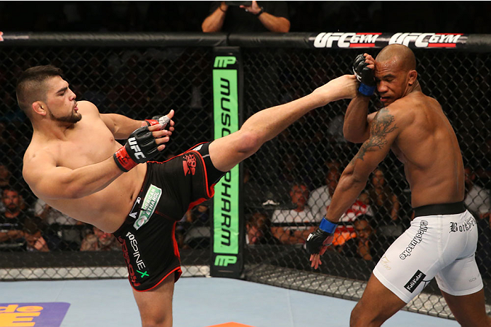 SAN ANTONIO, TX - JUNE 28: (L-R) Kelvin Gastelum kicks Nico Musoke in their welterweight bout at the AT&T Center on June 28, 2014 in San Antonio, Texas. (Photo by Ed Mulholland/Zuffa LLC/Zuffa LLC via Getty Images)