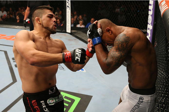SAN ANTONIO, TX - JUNE 28: (L-R) Kelvin Gastelum punches Nico Musoke in their welterweight bout at the AT&T Center on June 28, 2014 in San Antonio, Texas. (Photo by Ed Mulholland/Zuffa LLC/Zuffa LLC via Getty Images)