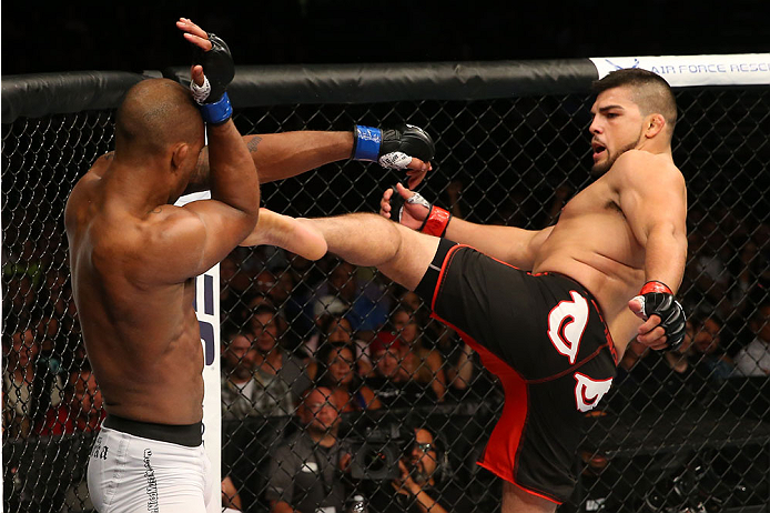 SAN ANTONIO, TX - JUNE 28: (R-L) Kelvin Gastelum kicks Nico Musoke in their welterweight bout at the AT&T Center on June 28, 2014 in San Antonio, Texas. (Photo by Ed Mulholland/Zuffa LLC/Zuffa LLC via Getty Images)