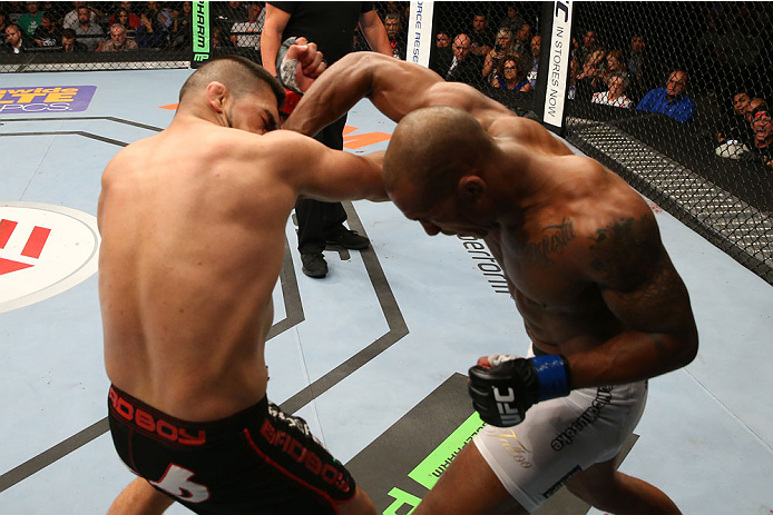 SAN ANTONIO, TX - JUNE 28: (R-L) Nico Musoke punches Kelvin Gastelum in their welterweight bout at the AT&T Center on June 28, 2014 in San Antonio, Texas. (Photo by Ed Mulholland/Zuffa LLC/Zuffa LLC via Getty Images)