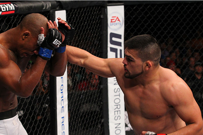SAN ANTONIO, TX - JUNE 28: (R-L) Kelvin Gastelum punches Nico Musoke in their welterweight bout at the AT&T Center on June 28, 2014 in San Antonio, Texas. (Photo by Ed Mulholland/Zuffa LLC/Zuffa LLC via Getty Images)