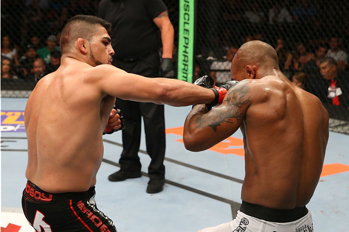 SAN ANTONIO, TX - JUNE 28: (L-R) Kelvin Gastelum punches Nico Musoke in their welterweight bout at the AT&T Center on June 28, 2014 in San Antonio, Texas. (Photo by Ed Mulholland/Zuffa LLC/Zuffa LLC via Getty Images)