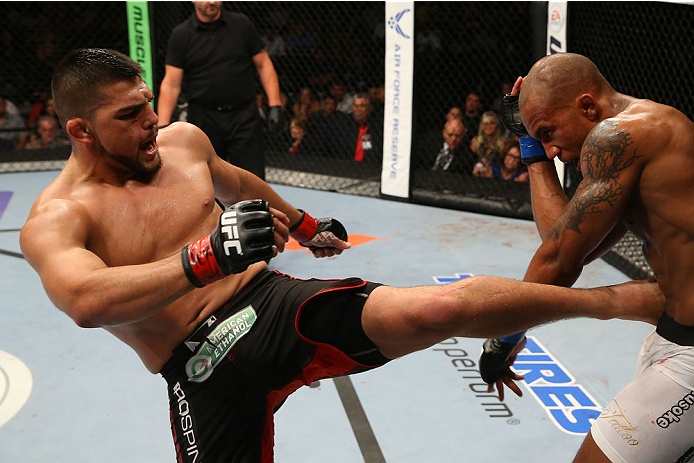 SAN ANTONIO, TX - JUNE 28: (L-R) Kelvin Gastelum kicks Nico Musoke in their welterweight bout at the AT&T Center on June 28, 2014 in San Antonio, Texas. (Photo by Ed Mulholland/Zuffa LLC/Zuffa LLC via Getty Images)