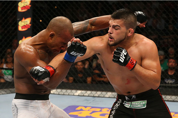 SAN ANTONIO, TX - JUNE 28: (R-L) Kelvin Gastelum punches Nico Musoke in their welterweight bout at the AT&T Center on June 28, 2014 in San Antonio, Texas. (Photo by Ed Mulholland/Zuffa LLC/Zuffa LLC via Getty Images)