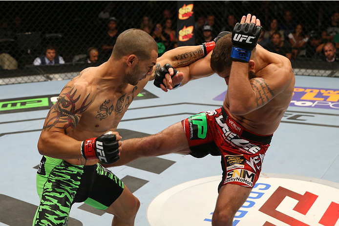 SAN ANTONIO, TX - JUNE 28: (L-R) Cub Swanson punches Jeremy Stephens in their featherweight bout at the AT&T Center on June 28, 2014 in San Antonio, Texas. (Photo by Ed Mulholland/Zuffa LLC/Zuffa LLC via Getty Images)