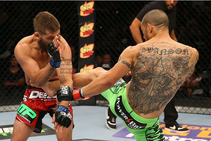 SAN ANTONIO, TX - JUNE 28: (R-L) Cub Swanson kicks Jeremy Stephens in their featherweight bout at the AT&T Center on June 28, 2014 in San Antonio, Texas. (Photo by Ed Mulholland/Zuffa LLC/Zuffa LLC via Getty Images)