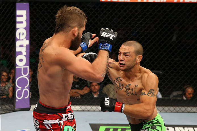 SAN ANTONIO, TX - JUNE 28: (R-L) Cub Swanson punches Jeremy Stephens in their featherweight bout at the AT&T Center on June 28, 2014 in San Antonio, Texas. (Photo by Ed Mulholland/Zuffa LLC/Zuffa LLC via Getty Images)