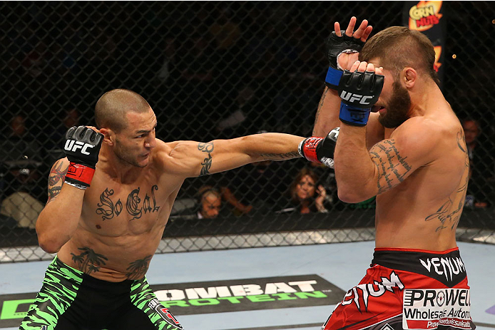 SAN ANTONIO, TX - JUNE 28: (L-R) Cub Swanson punches Jeremy Stephens in their featherweight bout at the AT&T Center on June 28, 2014 in San Antonio, Texas. (Photo by Ed Mulholland/Zuffa LLC/Zuffa LLC via Getty Images)