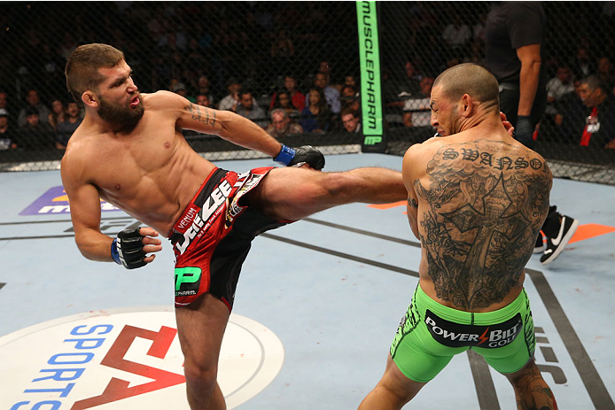 SAN ANTONIO, TX - JUNE 28: (L-R) Jeremy Stephens kicks Cub Swanson in their featherweight bout at the AT&T Center on June 28, 2014 in San Antonio, Texas. (Photo by Ed Mulholland/Zuffa LLC/Zuffa LLC via Getty Images)