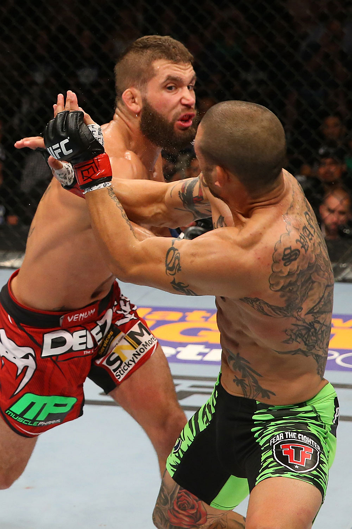 SAN ANTONIO, TX - JUNE 28: Jeremy Stephens (top) punches Cub Swanson in their featherweight bout at the AT&T Center on June 28, 2014 in San Antonio, Texas. (Photo by Ed Mulholland/Zuffa LLC/Zuffa LLC via Getty Images)