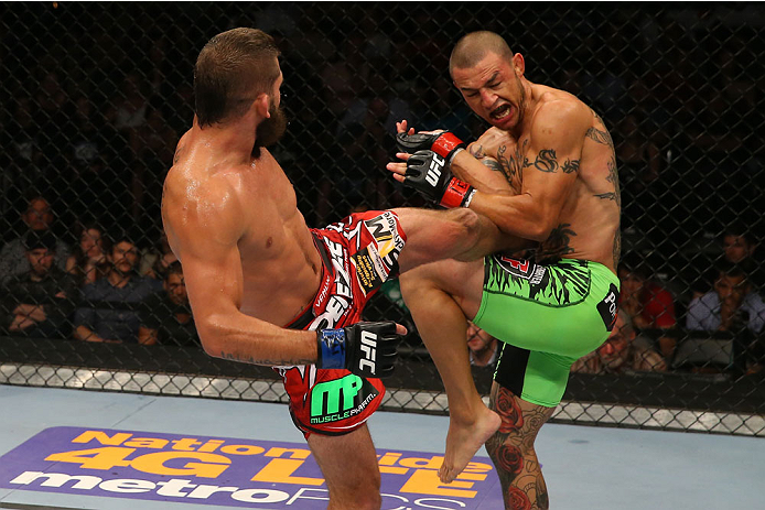 SAN ANTONIO, TX - JUNE 28: (L-R) Jeremy Stephens kicks Cub Swanson in their featherweight bout at the AT&T Center on June 28, 2014 in San Antonio, Texas. (Photo by Ed Mulholland/Zuffa LLC/Zuffa LLC via Getty Images)