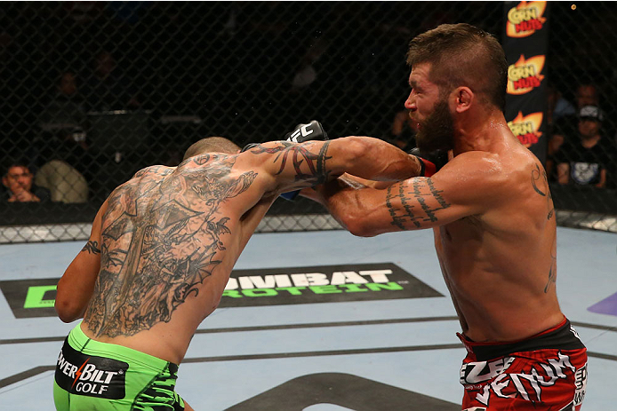 SAN ANTONIO, TX - JUNE 28: (L-R) Cub Swanson punches Jeremy Stephens in their featherweight bout at the AT&T Center on June 28, 2014 in San Antonio, Texas. (Photo by Ed Mulholland/Zuffa LLC/Zuffa LLC via Getty Images)