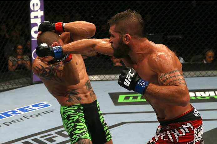 SAN ANTONIO, TX - JUNE 28: (R-L) Jeremy Stephens punches Cub Swanson in their featherweight bout at the AT&T Center on June 28, 2014 in San Antonio, Texas. (Photo by Ed Mulholland/Zuffa LLC/Zuffa LLC via Getty Images)