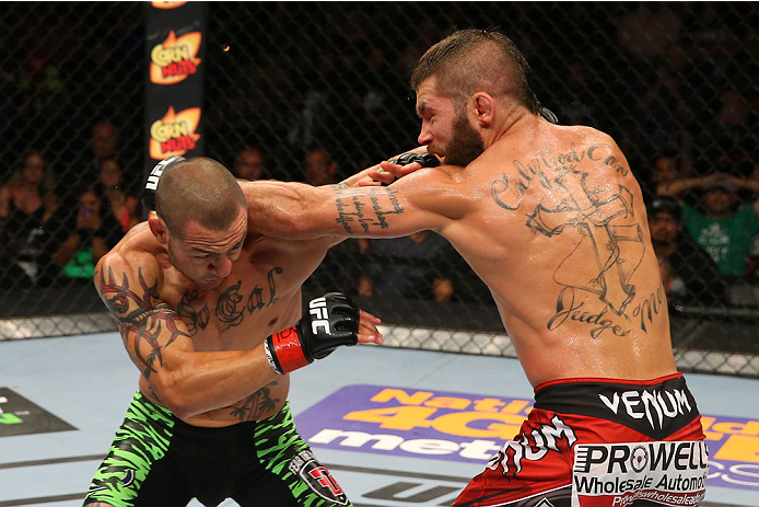 SAN ANTONIO, TX - JUNE 28: (L-R) Cub Swanson punches Jeremy Stephens in their featherweight bout at the AT&T Center on June 28, 2014 in San Antonio, Texas. (Photo by Ed Mulholland/Zuffa LLC/Zuffa LLC via Getty Images)