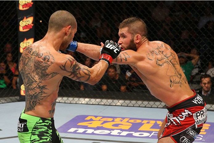 SAN ANTONIO, TX - JUNE 28: (R-L) Jeremy Stephens punches Cub Swanson in their featherweight bout at the AT&T Center on June 28, 2014 in San Antonio, Texas. (Photo by Ed Mulholland/Zuffa LLC/Zuffa LLC via Getty Images)