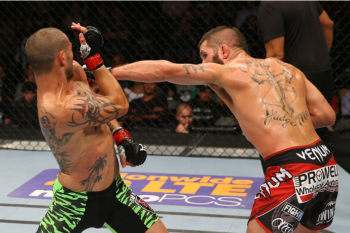 SAN ANTONIO, TX - JUNE 28: (R-L) Jeremy Stephens punches Cub Swanson in their featherweight bout at the AT&T Center on June 28, 2014 in San Antonio, Texas. (Photo by Ed Mulholland/Zuffa LLC/Zuffa LLC via Getty Images)