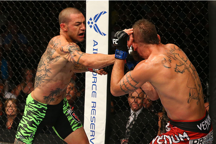 SAN ANTONIO, TX - JUNE 28: (L-R) Cub Swanson punches Jeremy Stephens in their featherweight bout at the AT&T Center on June 28, 2014 in San Antonio, Texas. (Photo by Ed Mulholland/Zuffa LLC/Zuffa LLC via Getty Images)