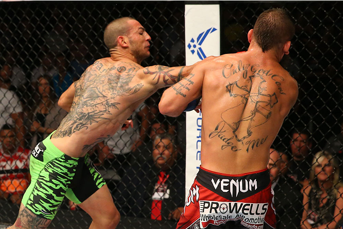 SAN ANTONIO, TX - JUNE 28: (L-R) Cub Swanson punches Jeremy Stephens in their featherweight bout at the AT&T Center on June 28, 2014 in San Antonio, Texas. (Photo by Ed Mulholland/Zuffa LLC/Zuffa LLC via Getty Images)