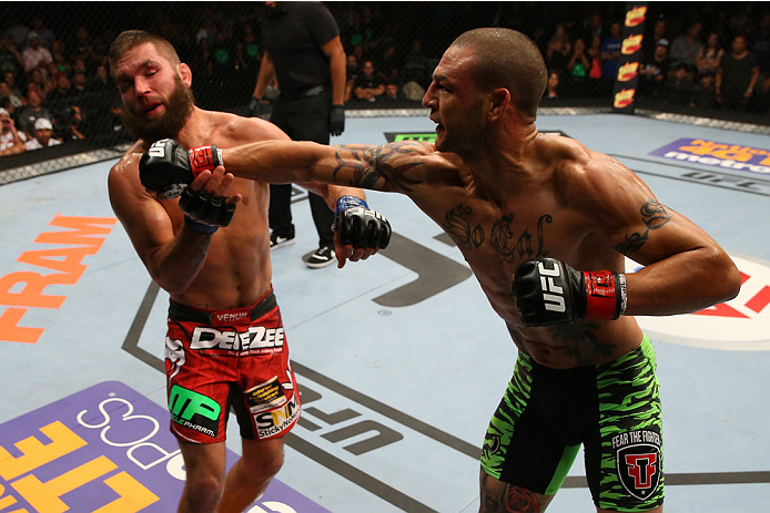 SAN ANTONIO, TX - JUNE 28: (R-L) Cub Swanson punches Jeremy Stephens in their featherweight bout at the AT&T Center on June 28, 2014 in San Antonio, Texas. (Photo by Ed Mulholland/Zuffa LLC/Zuffa LLC via Getty Images)