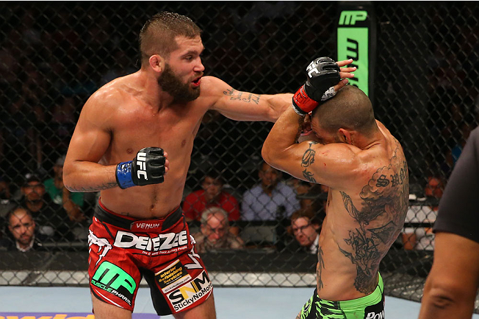 SAN ANTONIO, TX - JUNE 28: (L-R) Jeremy Stephens punches Cub Swanson in their featherweight bout at the AT&T Center on June 28, 2014 in San Antonio, Texas. (Photo by Ed Mulholland/Zuffa LLC/Zuffa LLC via Getty Images)